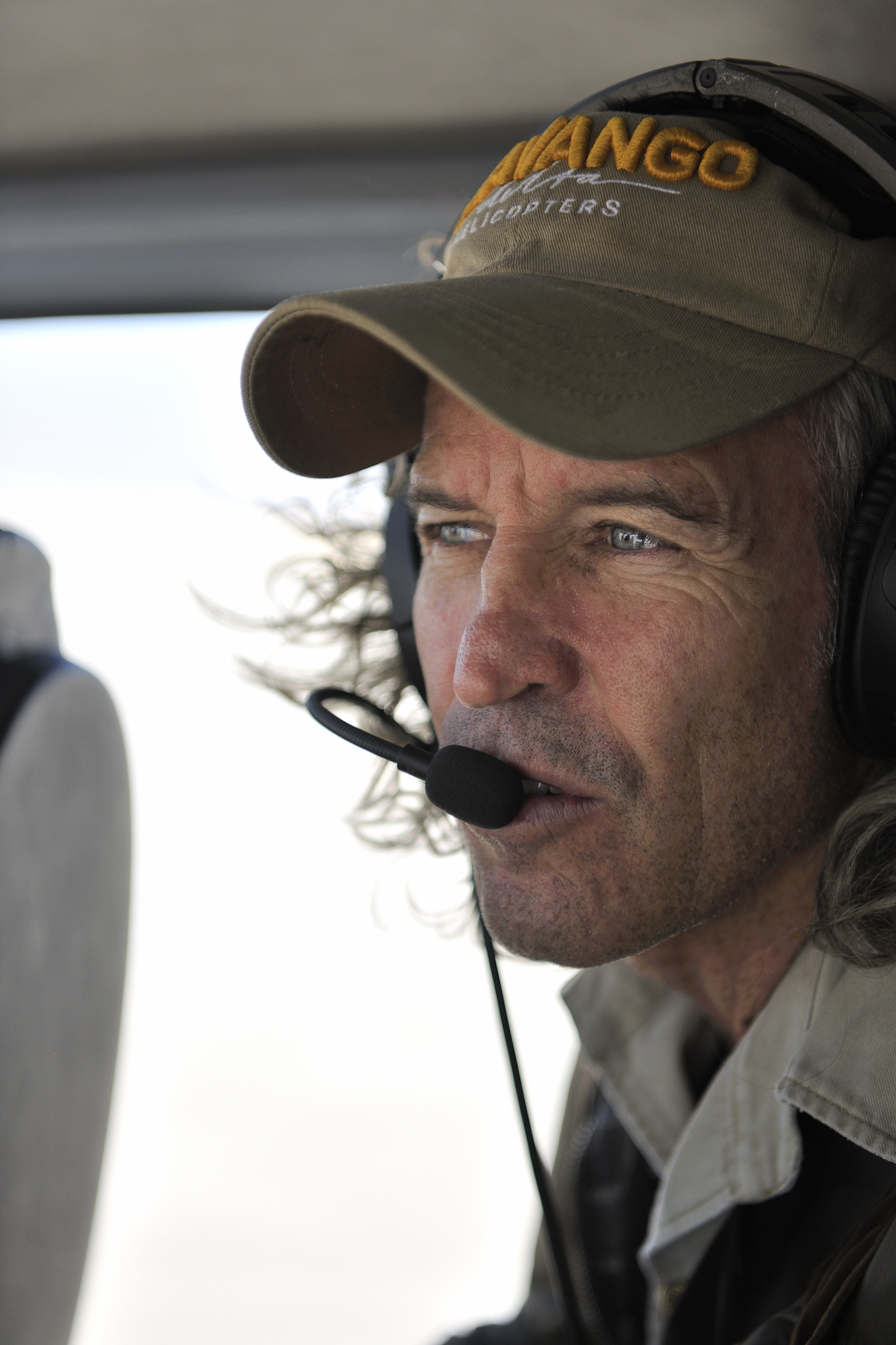 A close-up view of Ralph Bousfield piloting across the African wilderness—a unique perspective on a classic safari.